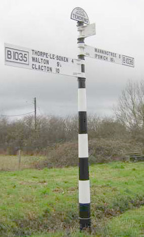 Signpost outside Gleeds Emporium, Tendring